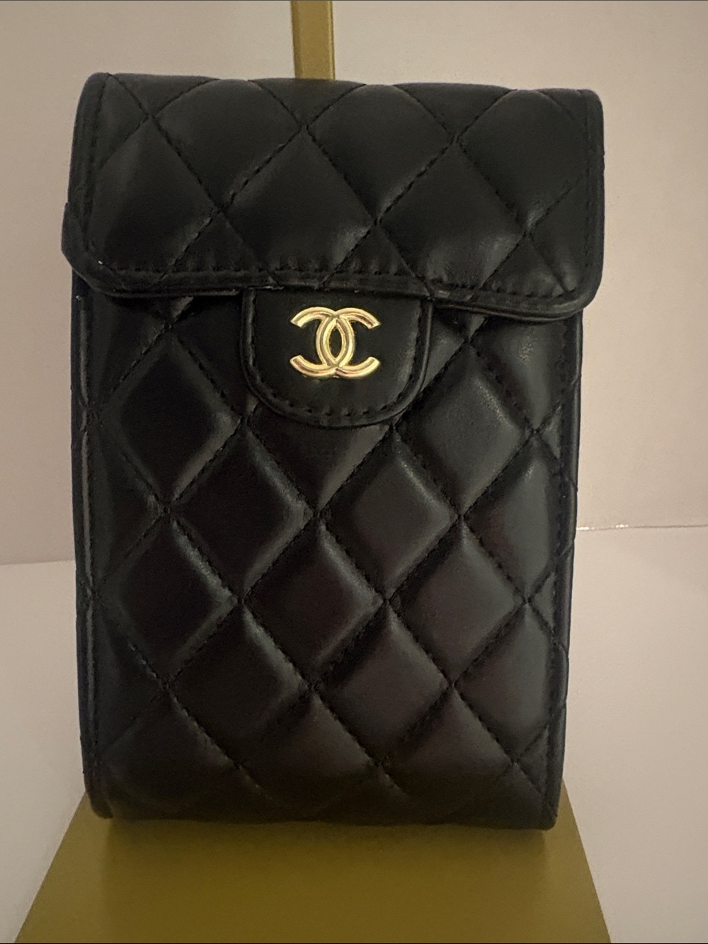 CHANEL Black Quilted Leather Phone Pouch with Gold CC Emblem